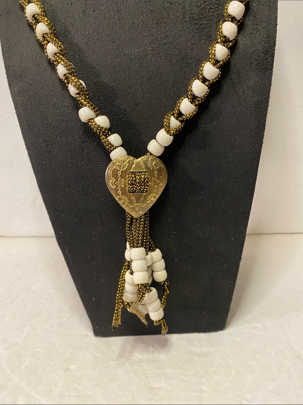 Beaded necklace with heart pendant and tassel
